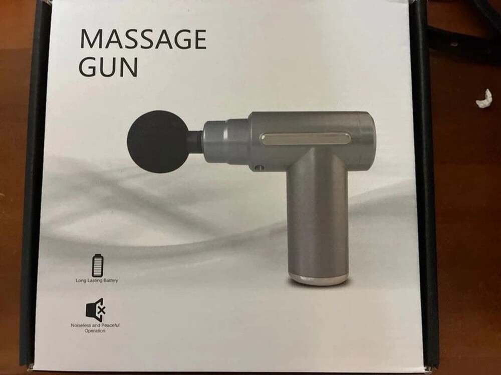 New in open box massage gun red with four head